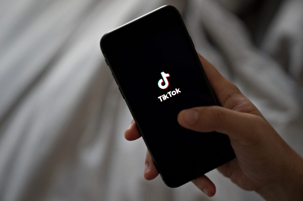 User scrolling through TikTok on smartphone